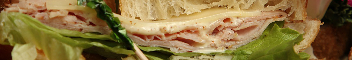 Eating Deli Sandwich at New York City Bagels & Deli Cafe restaurant in Union, NJ.
